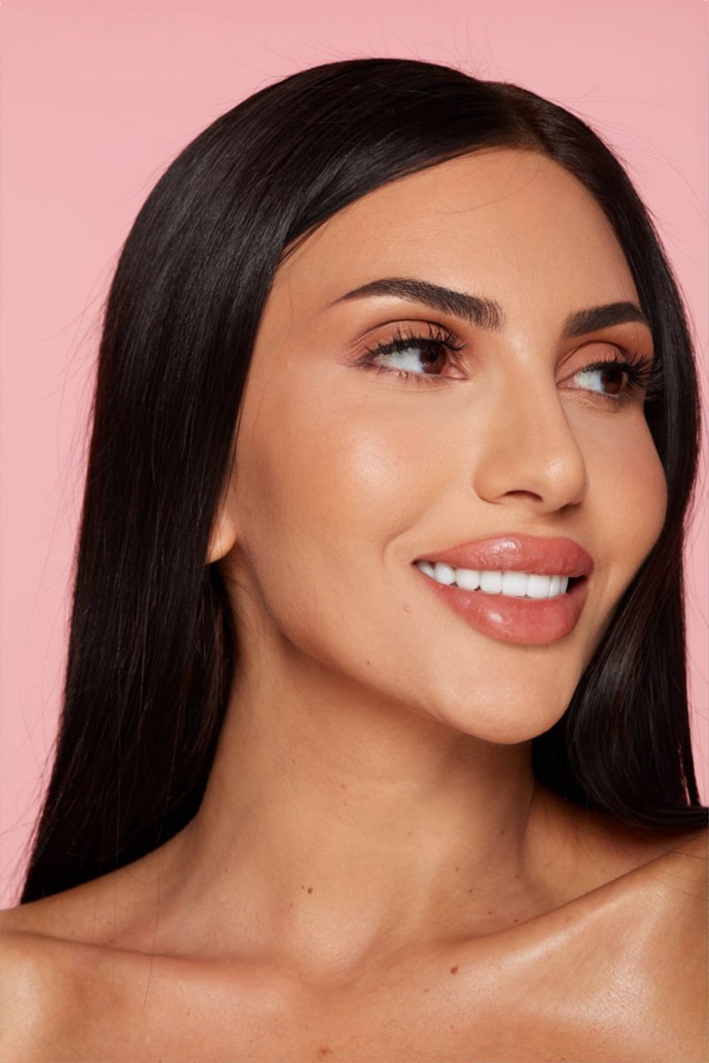 dark-haired facial patient model smiling